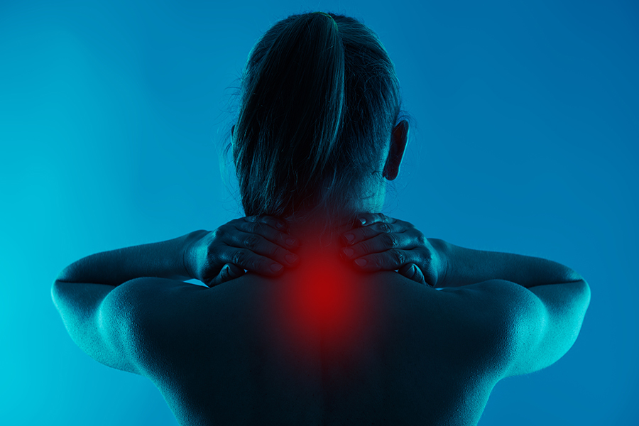 a woman's neck glows red with chronic neck pain