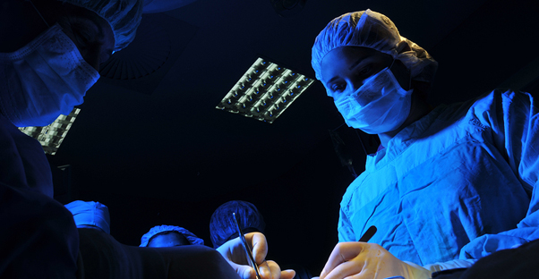 a doctor performs mesothelioma surgery